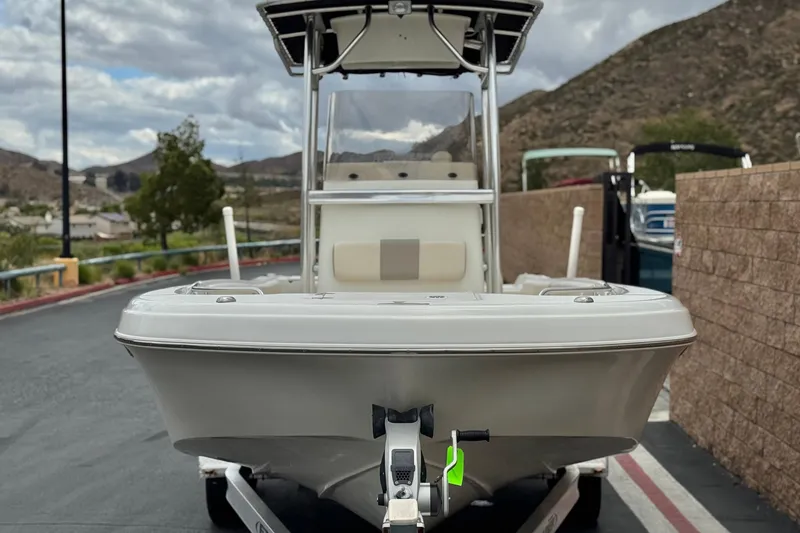 Slide: The Image of 2014 Carolina Skiff 23 Ultra Elite SS boat on trailer, mountainous background. - 2