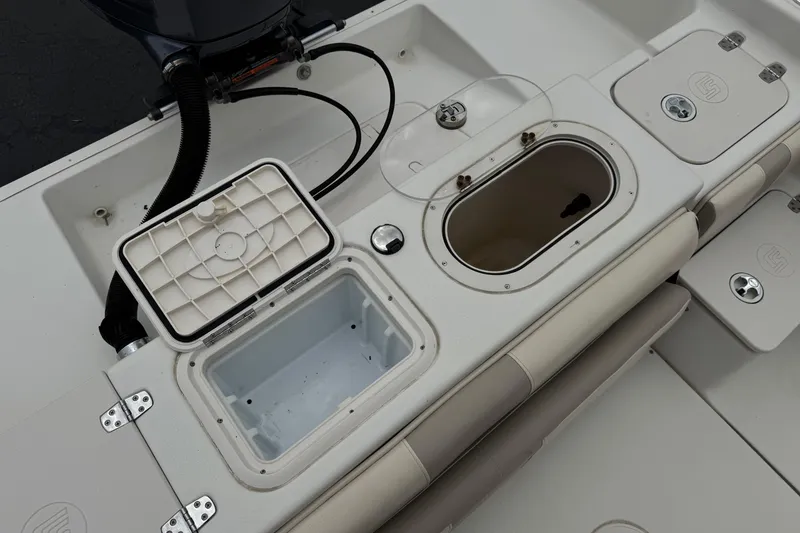 Slide: The Image of 2014 Carolina Skiff 23 Ultra Elite SS boat interior with storage compartments. - 25