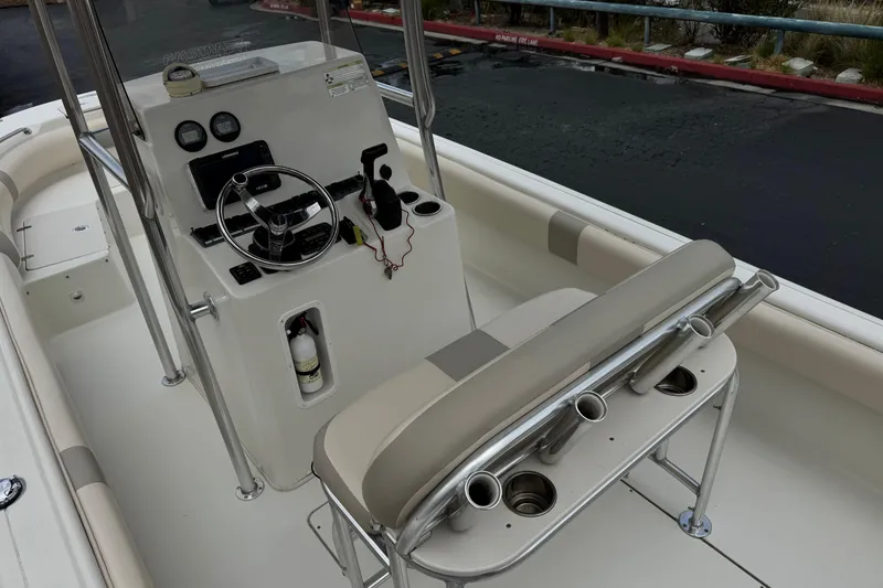 Slide: The Image of 2014 Carolina Skiff 23 Ultra Elite SS boat interior with steering console and seating. - 27