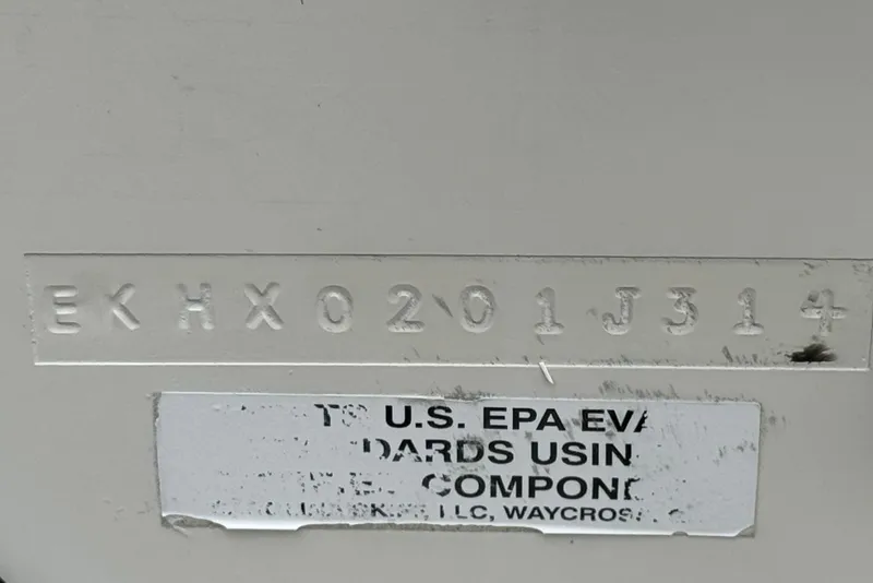 Slide: The Image of 2014 Carolina Skiff 23 Ultra Elite SS hull identification number and EPA compliance label. - 32