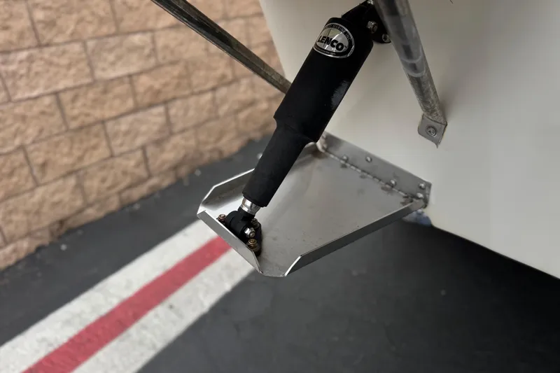 Slide: The Image of Trim tab of 2014 Carolina Skiff 23 Ultra Elite SS boat, featuring Lenco actuator. - 8