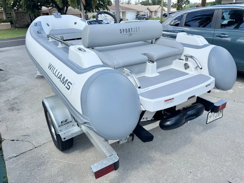 Slide: The Image of 2025 Williams Jet Tenders Sportjet 395 parked on a trailer. - 6