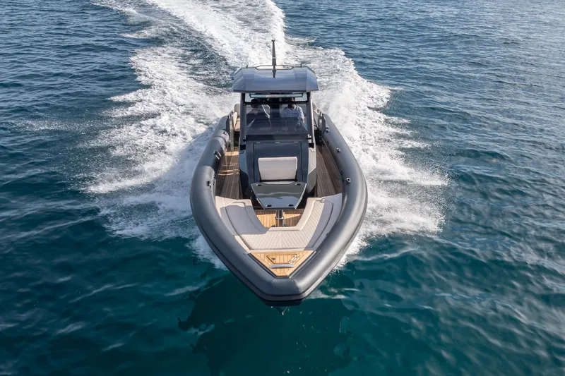 Slide: The Image of 2024 Skipper-BSK 38NC boat cruising on open water, showcasing sleek design and performance. - 4