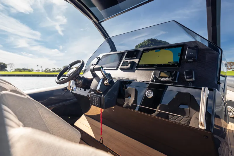 Slide: The Image of 2024 Skipper-BSK 38NC boat cockpit with modern navigation equipment and steering wheel. - 6