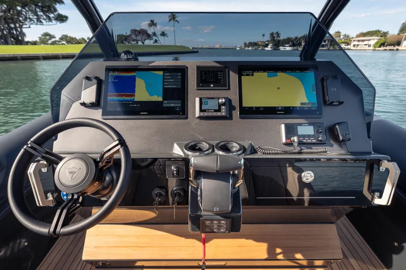 Slide: The Image of 2024 Skipper-BSK 38NC boat dashboard with advanced navigation displays and controls. - 7