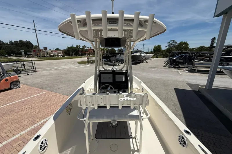 Slide: The Image of 2023 Skeeter SX2350 boat with Garmin navigation, parked outdoors under clear skies. - 11