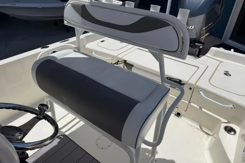 Slide: The Image of 2023 Skeeter SX2350 boat interior with cushioned seating and steering wheel. - 14