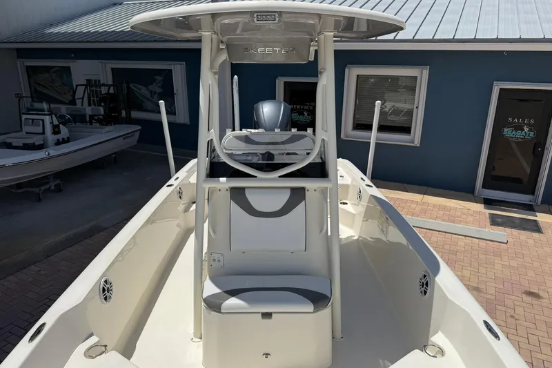 Slide: The Image of 2023 Skeeter SX2350 boat displayed at a dealership, showcasing sleek design and modern features. - 21