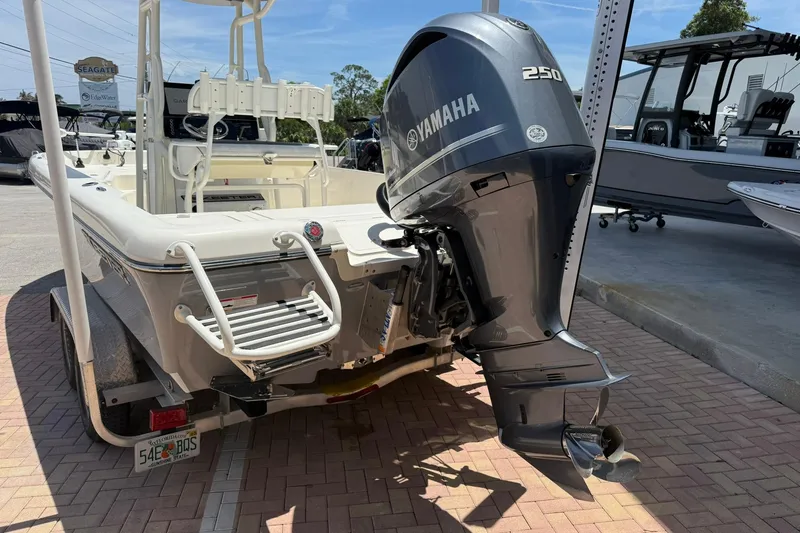 Slide: The Image of 2023 Skeeter SX2350 boat with Yamaha 250 engine on display at a dealership. - 3