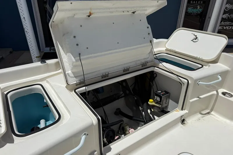 Slide: The Image of 2023 Skeeter SX2350 boat storage compartments and open hatch, showcasing interior components. - 9