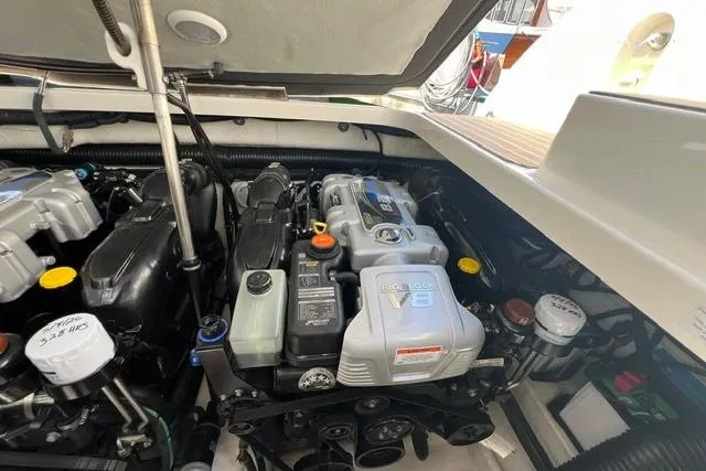 Slide: The Image of Engine compartment of a 2015 Formula 350 Sun Sport boat, showcasing a V8 engine. - 28