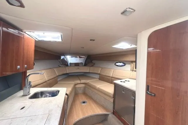 Slide: The Image of Interior of a 2015 Formula 350 Sun Sport boat with luxurious seating and kitchenette. - 14