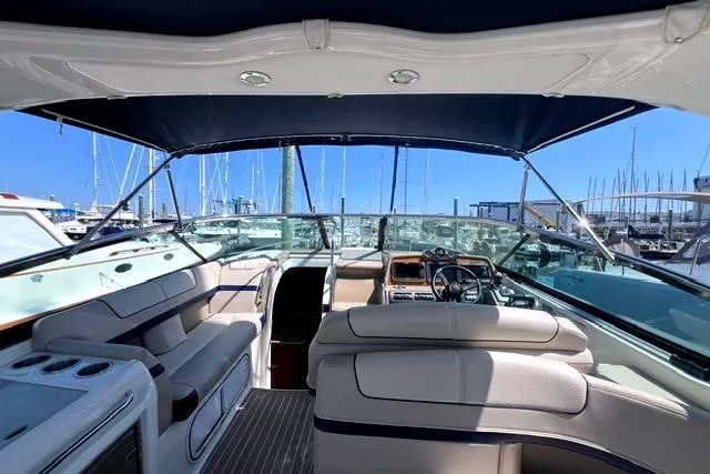Slide: The Image of Interior view of a 2015 Formula 350 Sun Sport boat at a marina. - 19