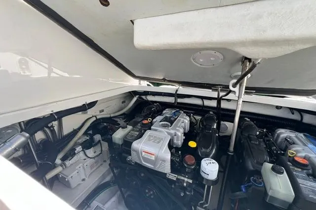 Slide: The Image of Engine compartment of a 2015 Formula 350 Sun Sport boat, showcasing detailed mechanical components. - 31