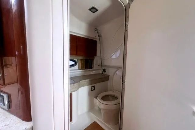 Slide: The Image of 2015 Formula 350 Sun Sport boat bathroom interior with toilet and sink. - 16