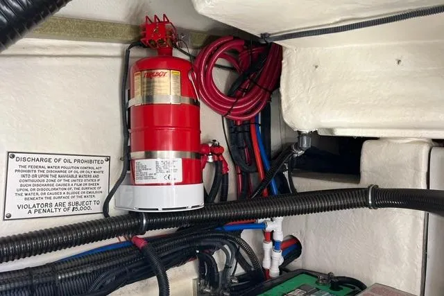 Slide: The Image of Engine compartment of a 2015 Formula 350 Sun Sport with fire extinguisher and wiring. - 30
