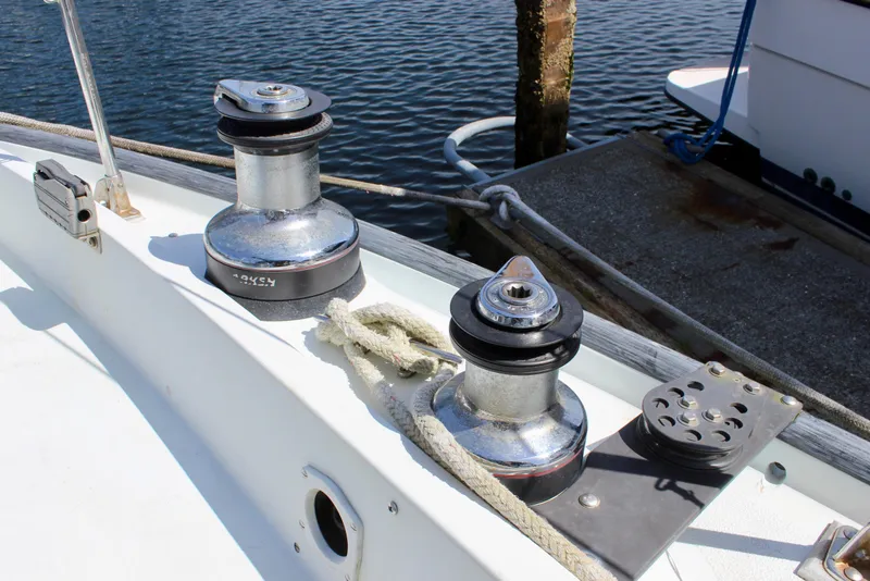 Slide: The Image of Sailboat deck with winches and ropes, Freya 39 model, 1993, docked by water. - 18