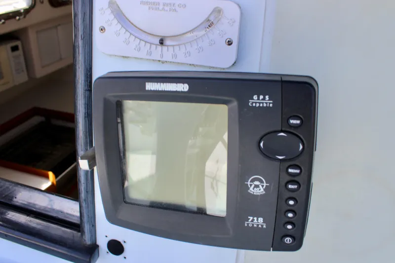 Slide: The Image of Humminbird GPS sonar device on 1993 Freya 39 boat dashboard. - 20