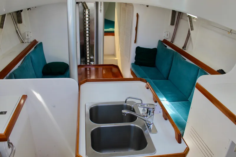 Slide: The Image of Interior of 1993 Freya 39 yacht with teal seating and dual sink. - 27