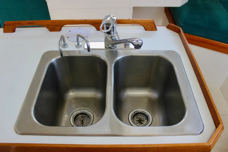 Slide: The Image of Double stainless steel sink on a 1993 Freya 39 yacht with wooden trim. - 29