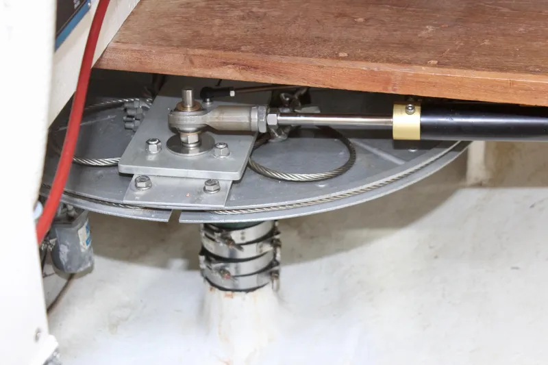 Slide: The Image of Steering mechanism of a 1993 Freya 39 sailboat, featuring cables and hydraulic components. - 35