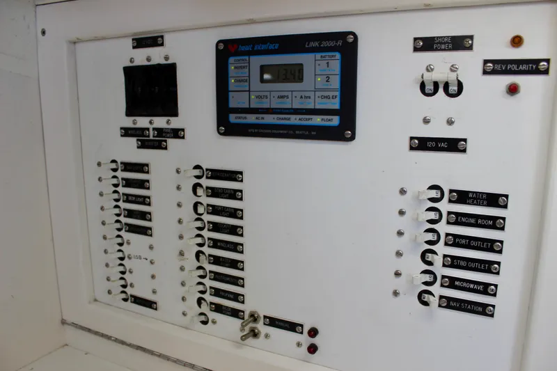 Slide: The Image of Electrical control panel on a 1993 Freya 39 boat, featuring switches and a digital display. - 39