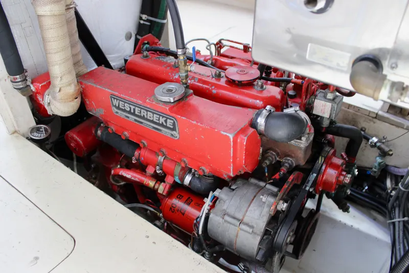 Slide: The Image of Red Westerbeke engine in a 1993 Freya 39 boat, showcasing detailed mechanical components. - 43
