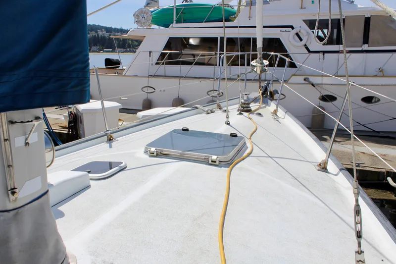 Slide: The Image of Deck view of a 1993 Freya 39 sailboat docked at a marina. - 5