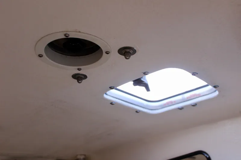 Slide: The Image of Ceiling view of a 1993 Freya 39 boat with open hatch and fixtures. - 56