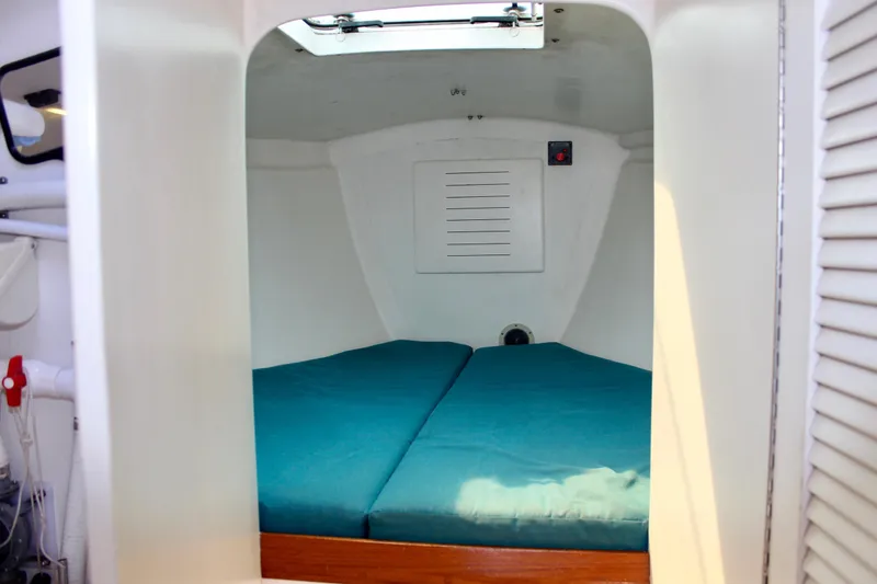 Slide: The Image of Cozy cabin interior of 1993 Freya 39 sailboat with teal bedding. - 57