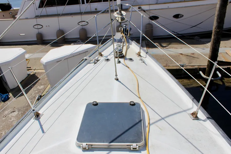 Slide: The Image of Deck view of a 1993 Freya 39 sailboat docked at a marina. - 6