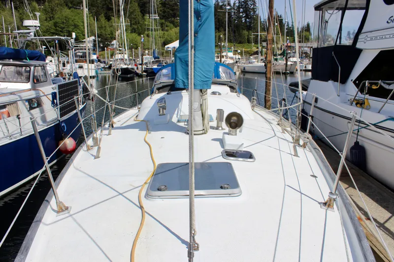 Slide: The Image of Sailboat docked in marina, Freya 39 model, 1993, surrounded by other boats. - 9