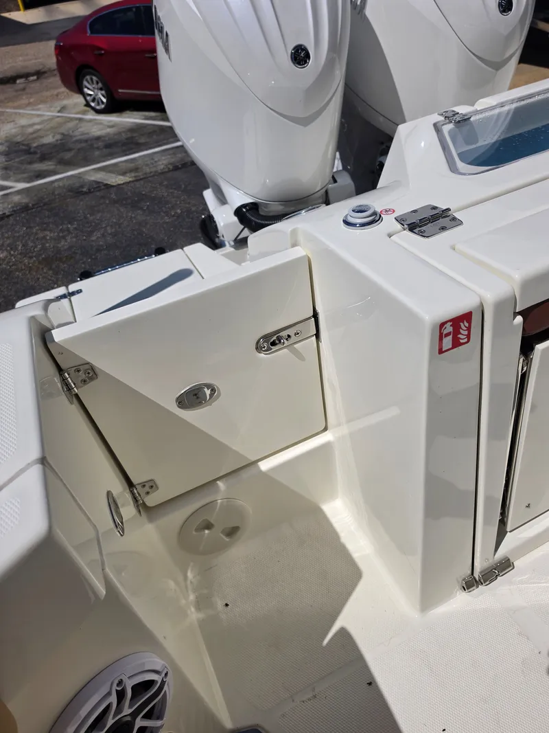 Slide: The Image of Cobia 245CC 2026 boat with engines and storage area. - 10