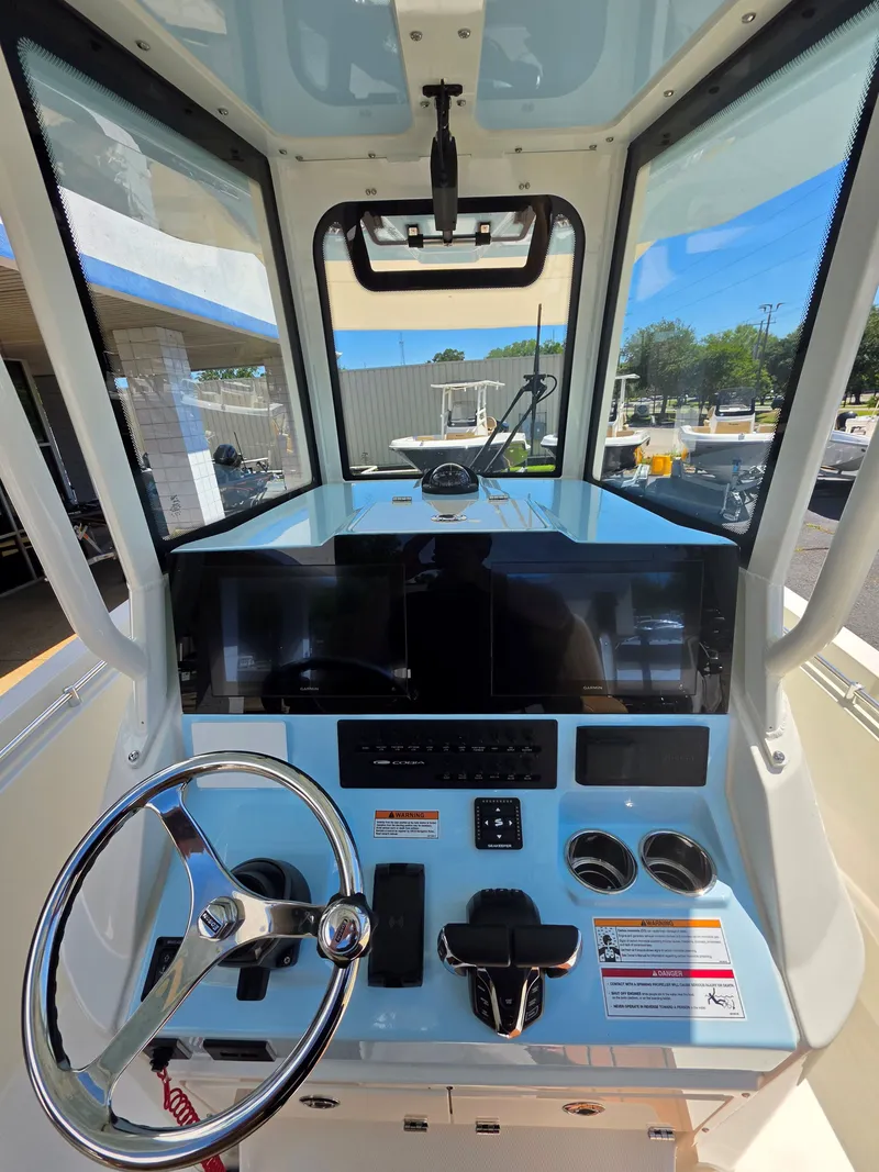 Slide: The Image of Interior view of a 2026 Cobia 245CC boat cockpit. - 19