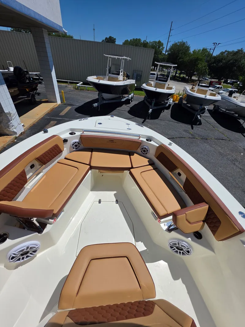 Slide: The Image of Interior view of 2026 Cobia 245CC with beige seating. - 21