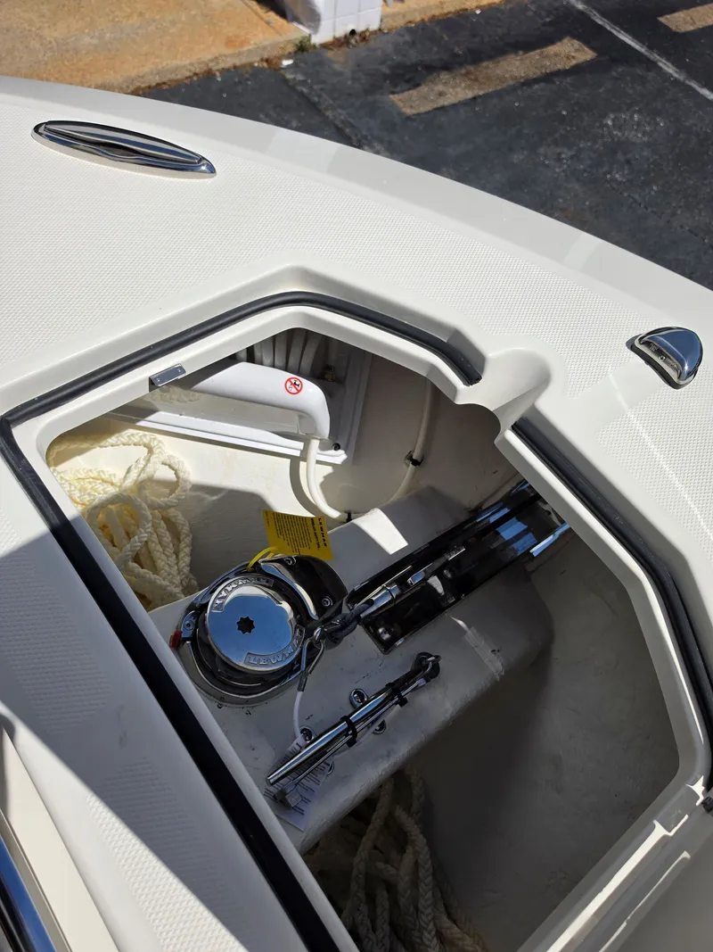 Slide: The Image of Anchor locker of 2026 Cobia 245CC with rope and winch. - 29