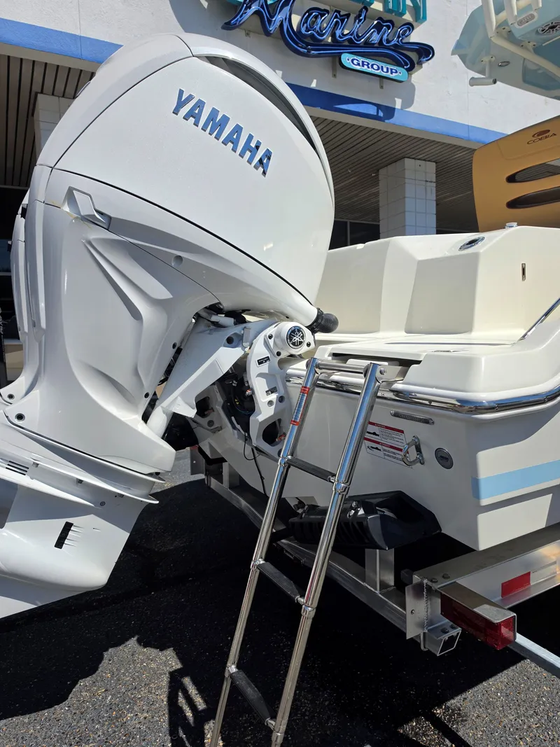 Slide: The Image of Cobia 245CC 2026 with Yamaha outboard motor and ladder. - 6