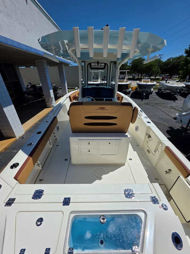 Slide: The Image of Interior view of 2026 Cobia 245CC boat with seating and storage area. - 7