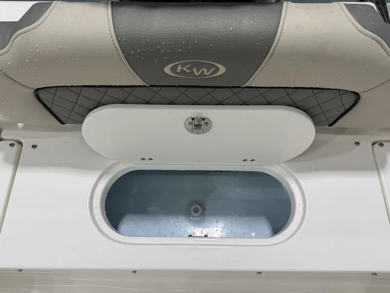 Slide: The Image of Key West 189 FS 2026 boat with storage compartment and cushioning. - 14