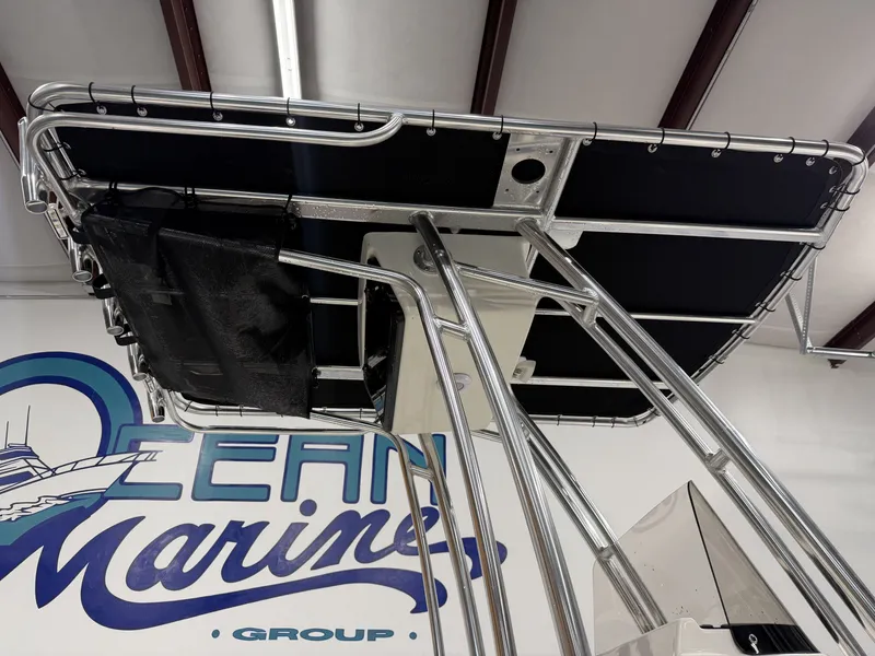 Slide: The Image of Key West 189 FS 2026 boat roof in a marina workshop. - 32