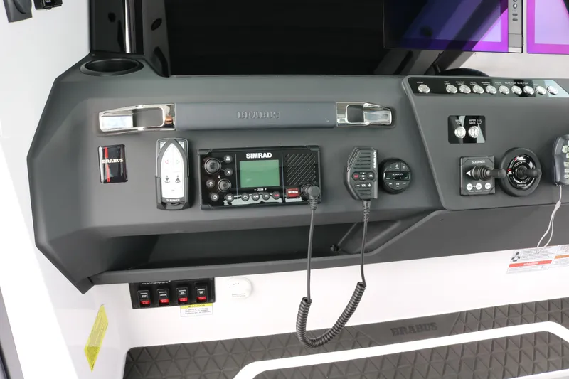 Slide: The Image of Control panel of 2026 Axopar 29 XC Cross Cabin with navigation and communication equipment. - 38