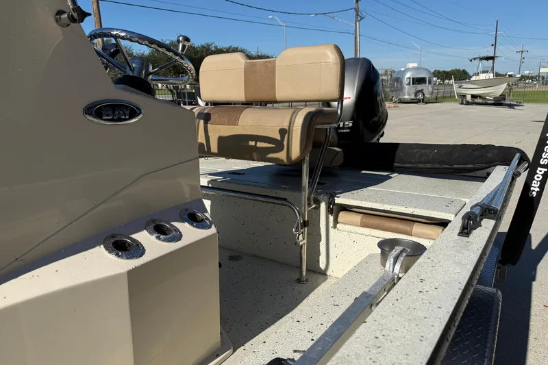 Slide: The Image of 2020 Xpress H20B Bay boat interior with seating and steering wheel. - 10