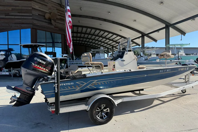 Slide: The Image of 2020 Xpress H20B Bay boat with Yamaha engine on trailer, displayed outdoors. - 3