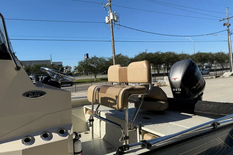 Slide: The Image of 2020 Xpress H20B Bay boat with Yamaha 115 engine, parked outdoors. - 7