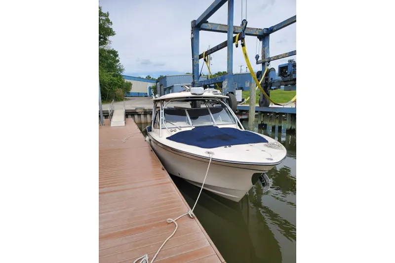 Slide: The Image of 2011 Grady-White Freedom 307 boat docked at marina, side view. - 8