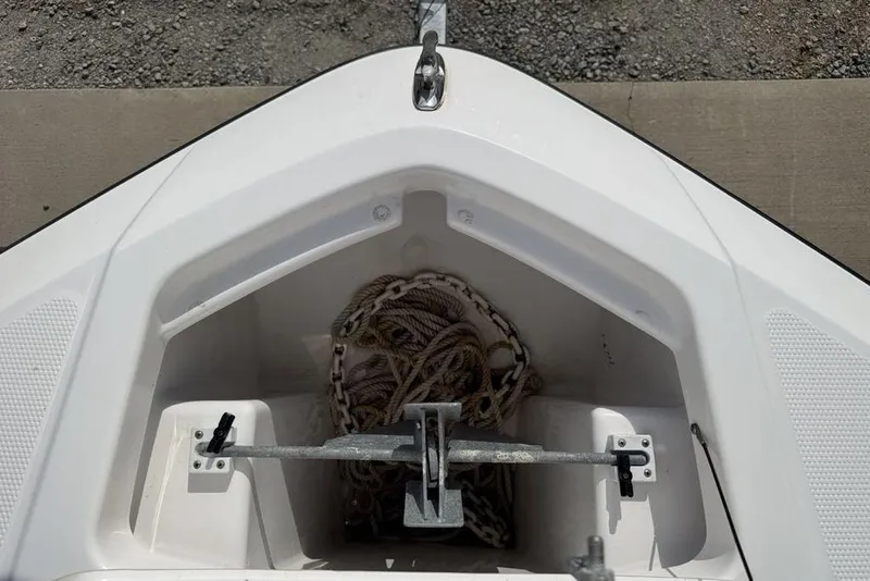 Slide: The Image of Anchor storage compartment on a 2020 Yamaha Boats 210 FSH Sport. - 11