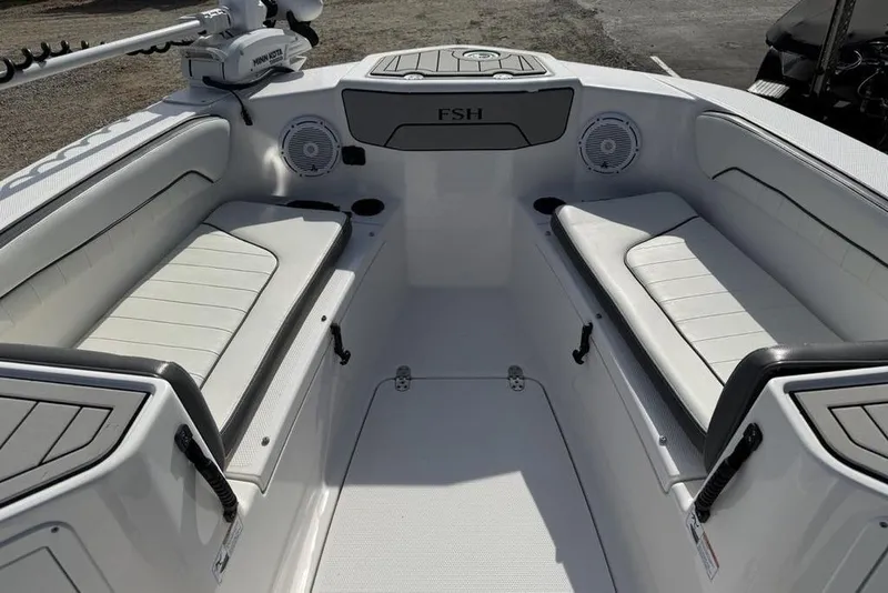 Slide: The Image of 2020 Yamaha Boats 210 FSH Sport interior with seating and speakers. - 14