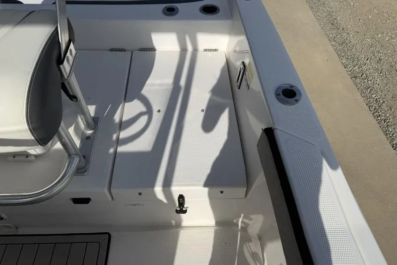 Slide: The Image of 2020 Yamaha Boats 210 FSH Sport interior, featuring seating and deck details. - 32