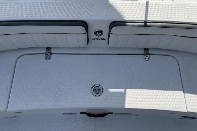 Slide: The Image of 2020 Yamaha Boats 210 FSH Sport deck with storage compartment and seating. - 35