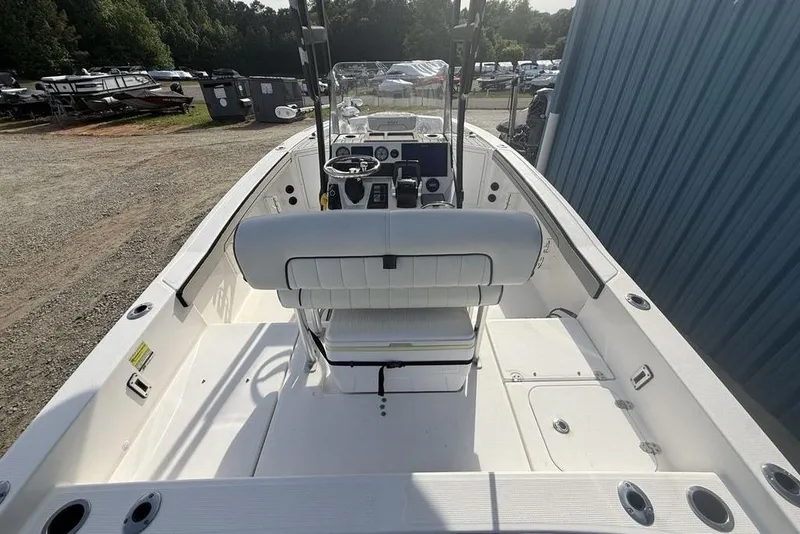 Slide: The Image of 2020 Yamaha Boats 210 FSH Sport interior view, showcasing helm and seating area. - 41